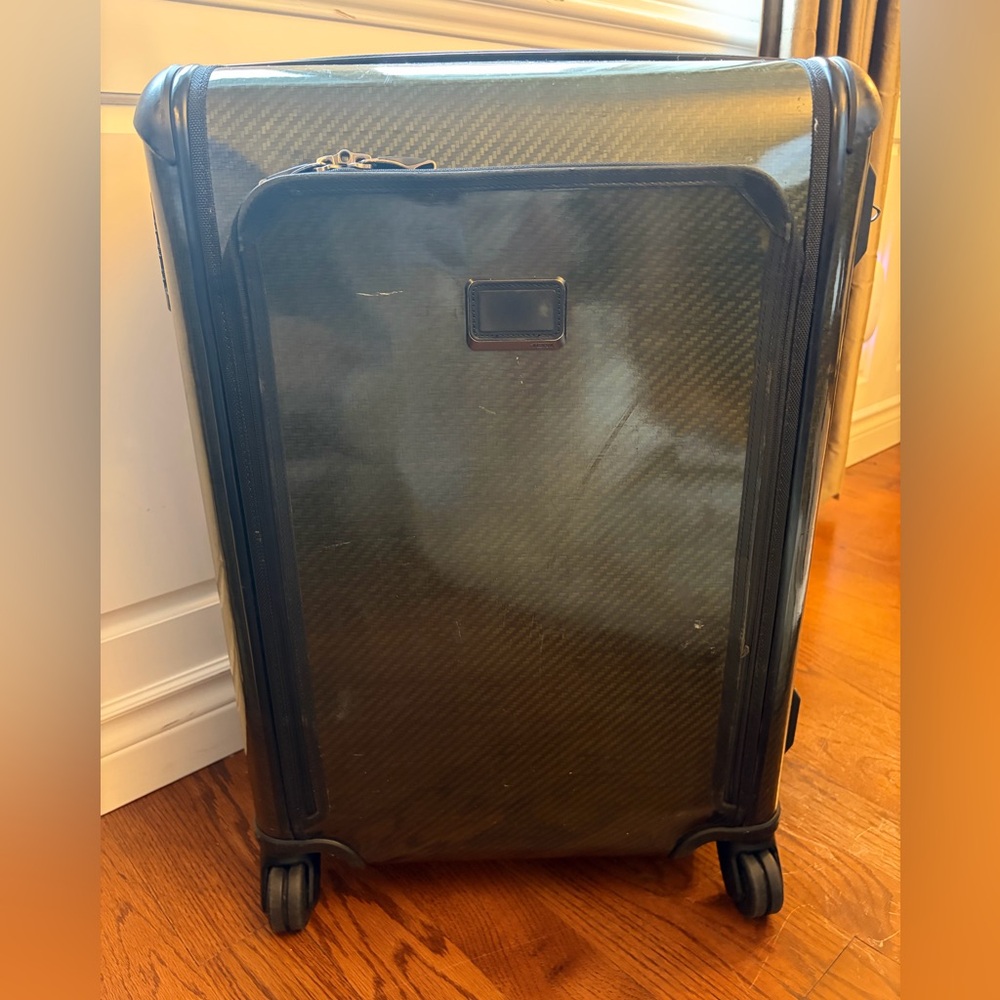 Black Hard Shell Tumi Medium Suitcase